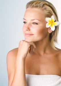 Beautiful woman with flower in her hair