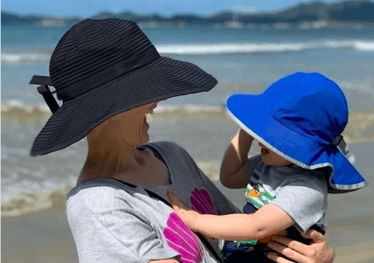 Woman and child at a beach