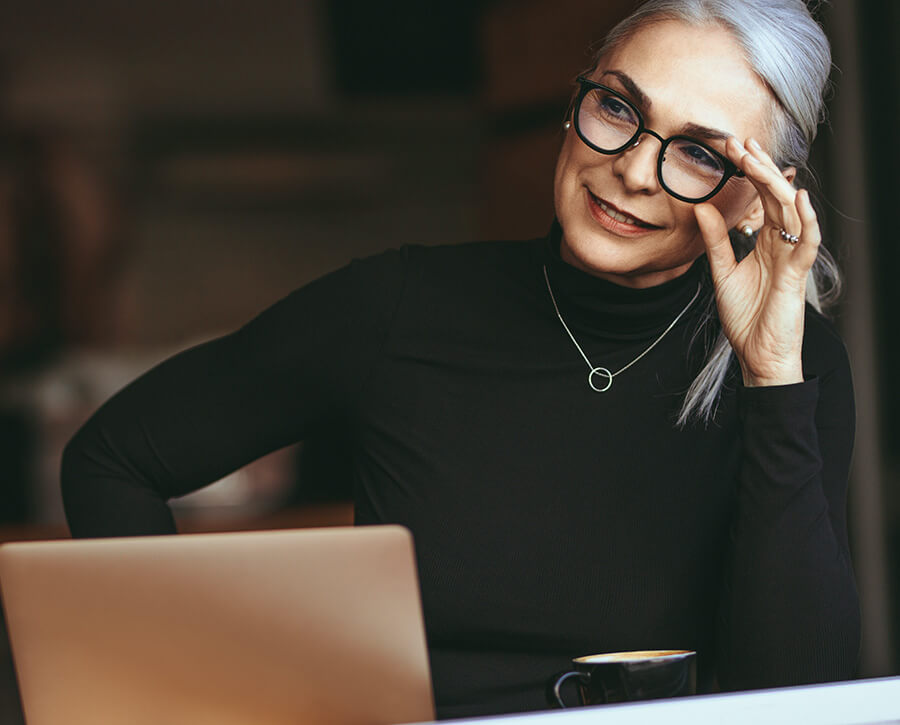 Mature woman holding glasses