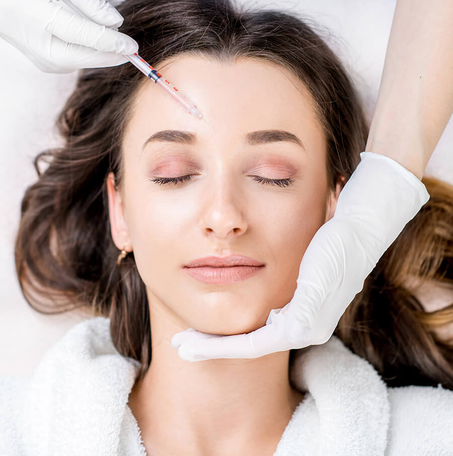 Woman getting facial injections