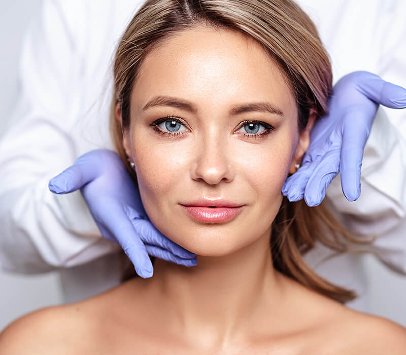 Headshot of a female model being examined by a doctor - mobile version