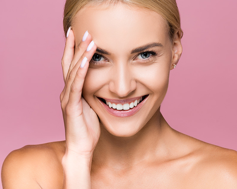 Beautiful woman touching her face