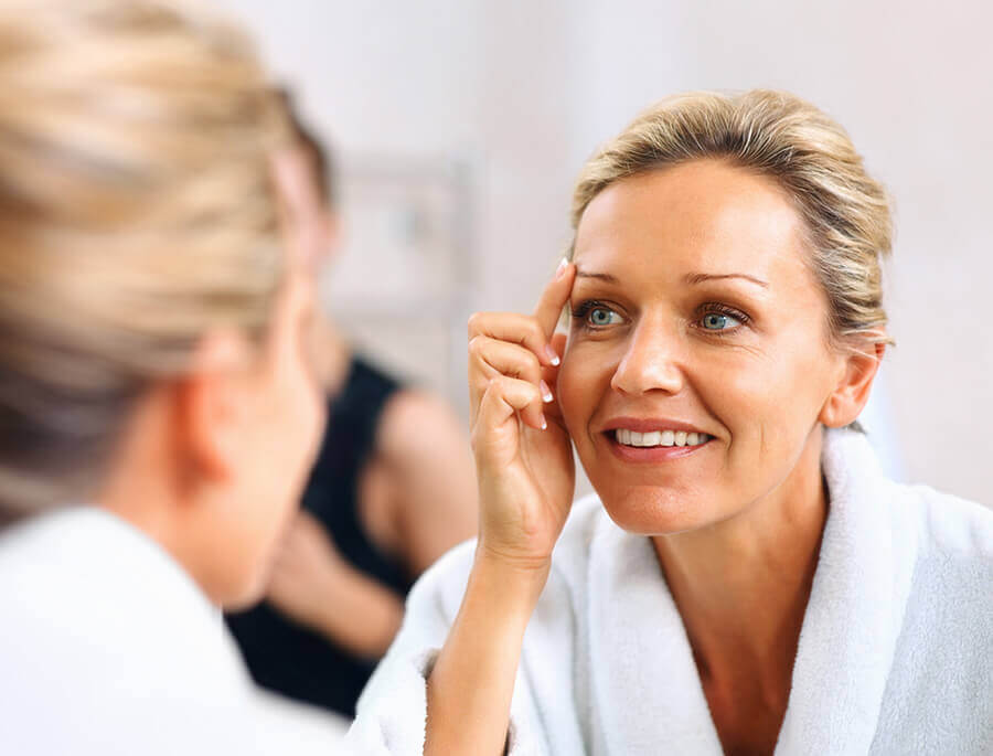 Woman looking in mirror