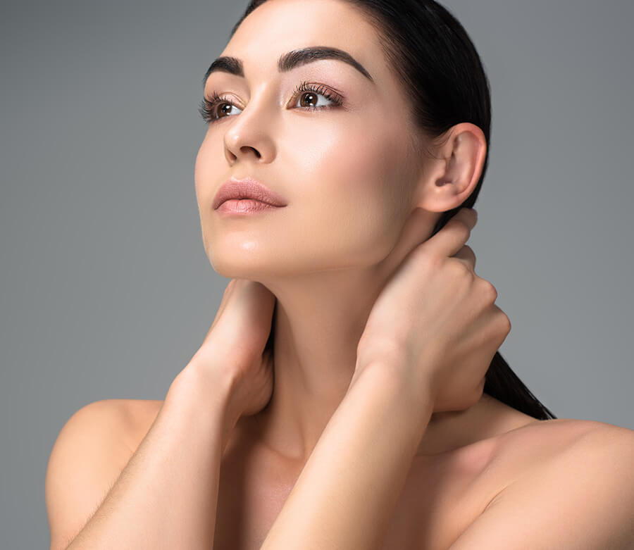 Beautiful woman holding neck