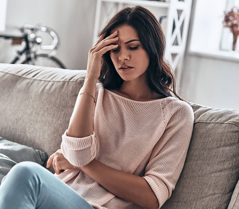 Woman suffering from a migraine