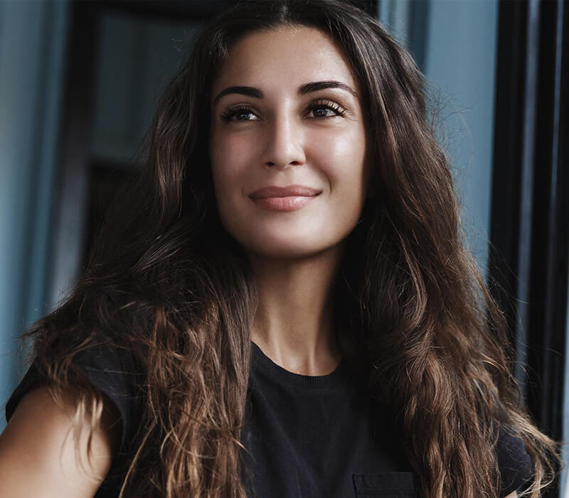 Woman with curly hair smiling