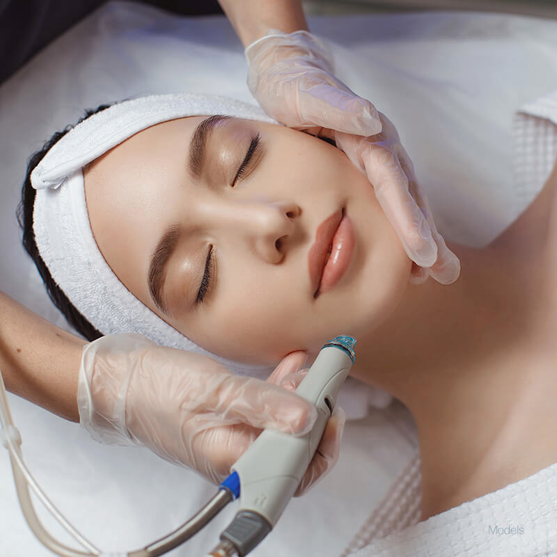 Woman getting a facial laser treatment