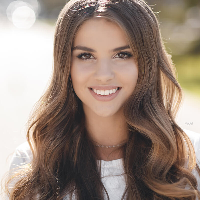 Female model smiling with long hair