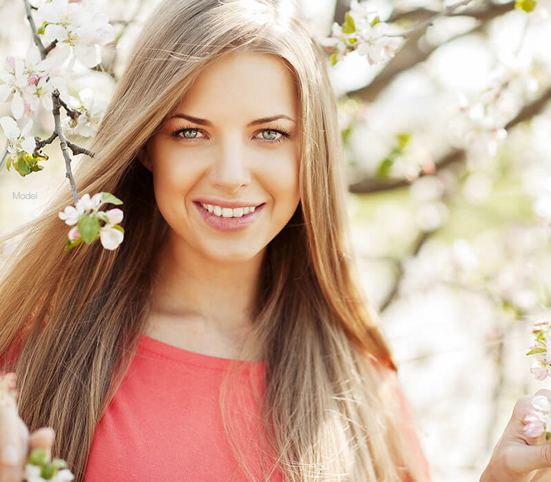 Female model by a pretty tree - mobile version